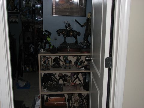 1991 Ford Bronco - A room filled with collectibles, action figures and statues on shelves.