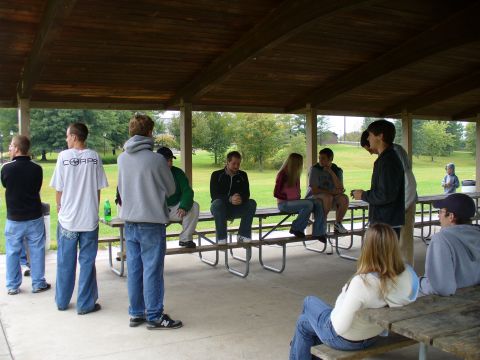 1991 Ford Probe - People gather for an outdoor event under a covered picnic area.