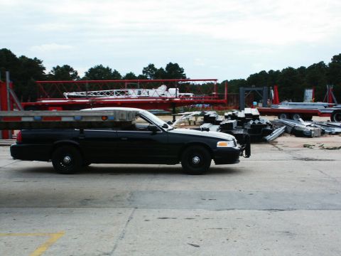 2001 Mercury Grand Marquis - A black 2001 Mercury Grand Marquis is seen from the side at a construction site.
