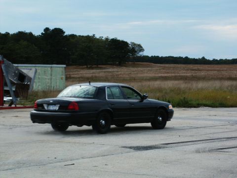 2001 Mercury Grand Marquis - Black 2001 Mercury Grand Marquis sedan seen from the side.