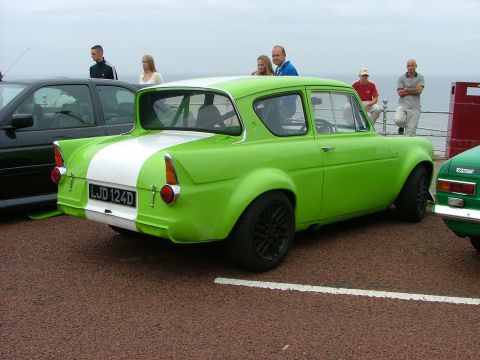2001 Ford Fiesta - This classic car, a 1966 model, is seen from the rear with a distinctive lime green paint job and a white stripe.