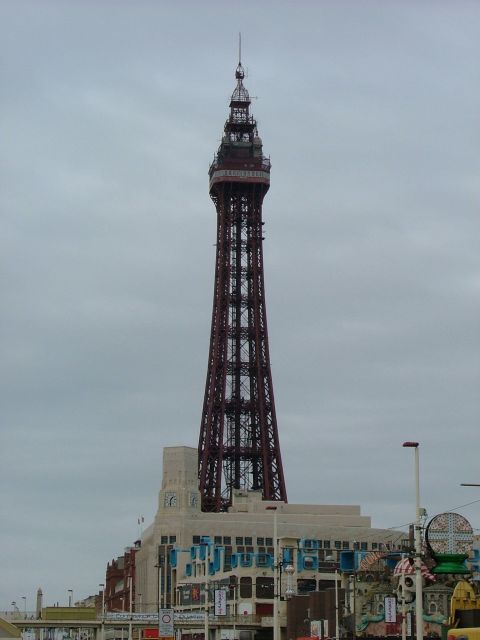 2001 Ford Fiesta - The iconic Blackpool Tower stands tall under an overcast sky, with the surrounding buildings visible below.