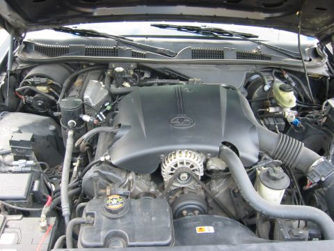 1999 Ford Crown Victoria - The engine bay of a 1999 Ford Crown Victoria is captured in this detailed photograph.