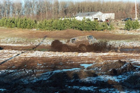 1979 Ford Bronco - A 1978 Ford Bronco navigates a challenging muddy terrain during a winter event.