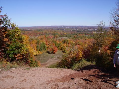 2000 Chevrolet Tahoe - View of autumn foliage from a hilltop, with a person standing on the right side.