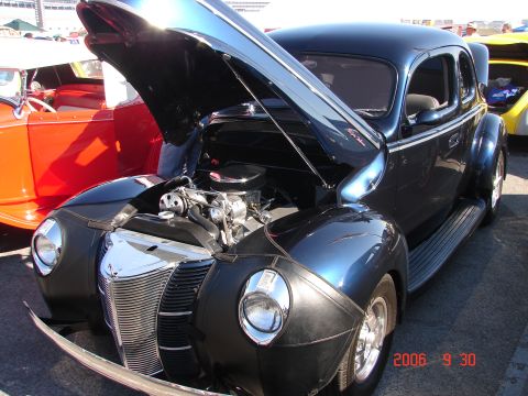 1987 Ford Bronco - Custom 1939 Ford Coupe hot rod at a car show, engine exposed for viewing.