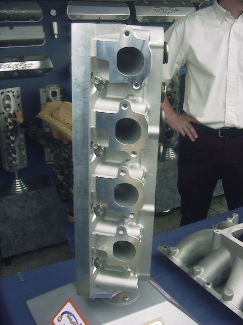 1990 Ford Mustang - Close-up of an aluminum engine cylinder head, likely for a performance application.