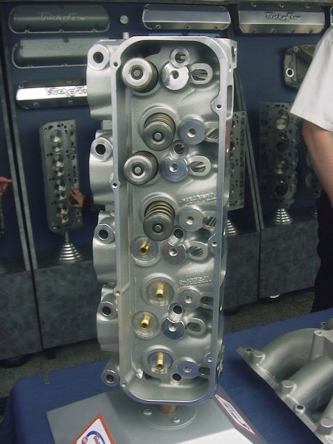 1990 Ford Mustang - Close-up view of an aluminum engine cylinder head, its internal components like valves and springs.