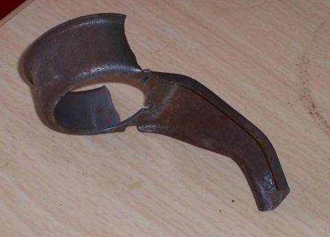 1978 Ford Bronco - This is a rusted metal part with a curved section and an angled extension.