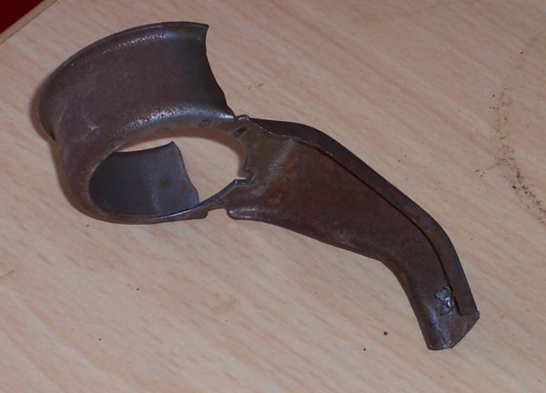 rusted metal part with curved and angled sections