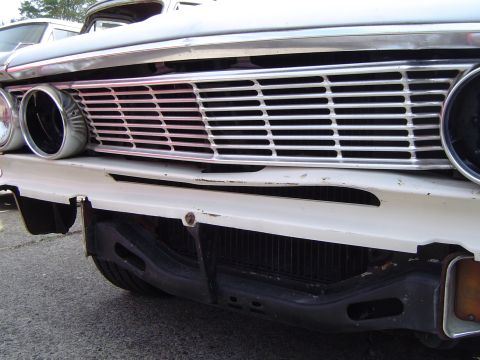 1964 Ford Fairlane - Close-up of the distinctive grille and front bumper of a 1964 Ford Fairlane.