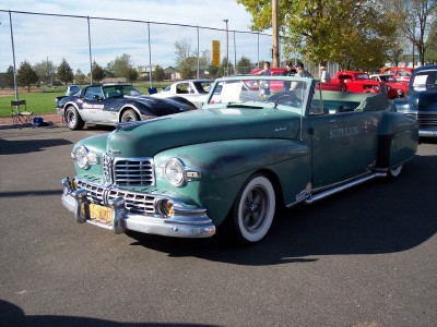 1972 Ford Ranchero - This 1946 Lincoln Continental convertible has 'SUPERIOR' written on its side and is parked at an outdoor event.