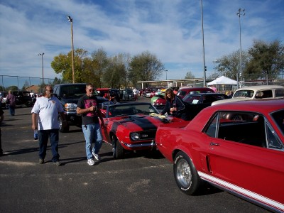 1972 Ford Ranchero - Several classic cars are on display at an outdoor event with people milling around.