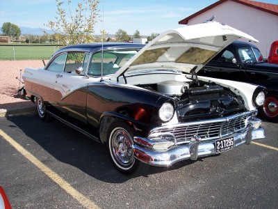 1972 Ford Ranchero - Two-tone 1956 Ford Fairlane Crown Victoria parked with its hood up.