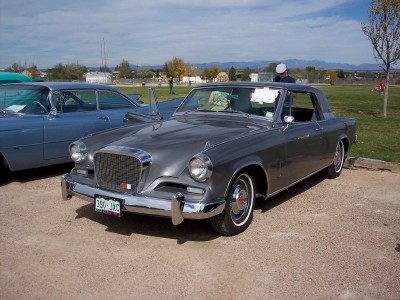 1972 Ford Ranchero - Studebaker Golden Hawk from 1957 at an outdoor car show.