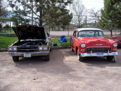 1972 Ford Ranchero - Two vintage cars are parked side-by-side outdoors, one with its hood up.