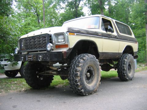 1992 Ford Mustang - Modified 1978 Ford Bronco on a dirt road, oversized tires and a winch bumper.