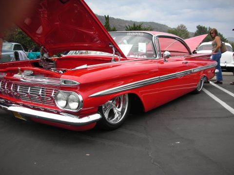 1992 Ford Crown Victoria - Customized 1959 Chevrolet Impala on display at a car show, hood raised to reveal the engine.
