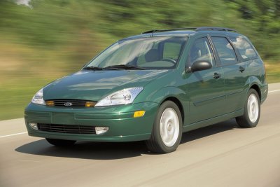 2002 Ford Focus - This 2002 Ford Focus wagon is captured in motion on a road, its green exterior.