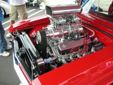 1992 Ford Crown Victoria - Custom chrome supercharger and engine details visible in a red vehicle's engine bay.