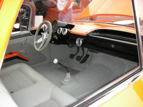 1992 Ford Crown Victoria - Custom interior features gray bucket seats, a floor-mounted shifter, and a dashboard with multiple gauges.