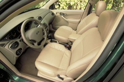 2002 Ford Focus - Interior view of a 2002 Ford Focus, highlighting the dashboard and tan leather seats.