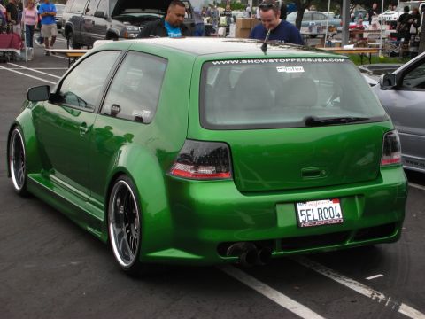 1992 Ford Crown Victoria - Modified green Volkswagen Golf GTI parked at an outdoor event. The car has custom bodywork and wheels.