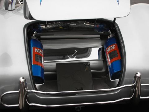 1992 Ford Crown Victoria - The open trunk of a silver car reveals two blue NOS bottles and other custom modifications.