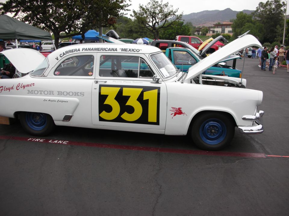 White race car with number 331 and red winged horse decal
