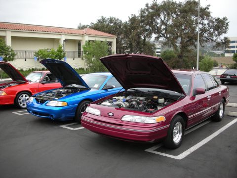 1992 Ford Crown Victoria - Maroon 1992 Ford Crown Victoria at a car show with its hood open.