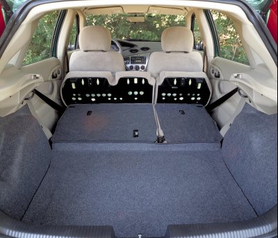 2002 Ford Focus - The spacious cargo area of a 2002 Ford Focus ZX5, with the rear seats folded down for maximum storage.