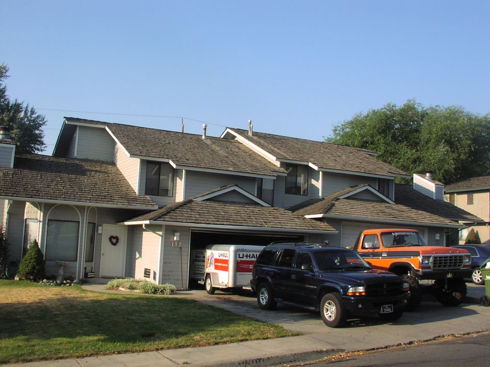 Orange pickup truck with black trim, 3q-front view. Readable text on grille