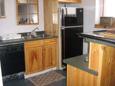 1995 Ford Bronco - Interior view of a kitchen area with appliances and cabinetry.