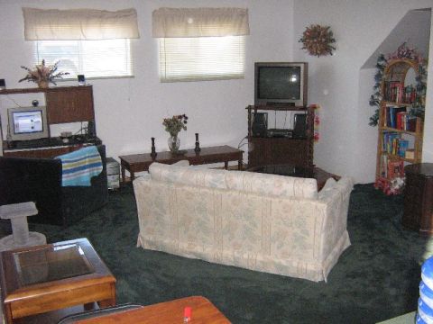 1995 Ford Bronco - Interior view of a living room furnished with a couch, coffee table, and entertainment center.