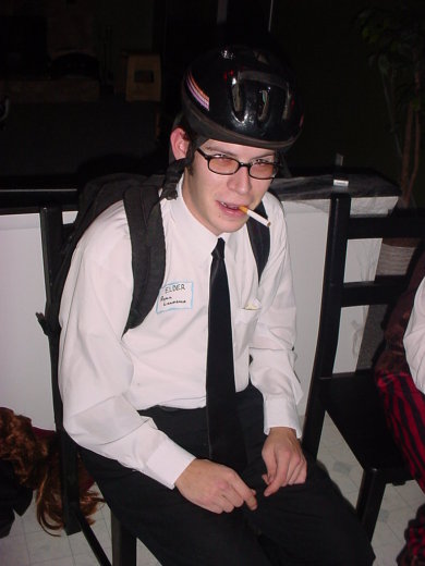 1995 Ford Probe - A person in a costume, possibly a missionary, sits with a cigarette in their mouth.