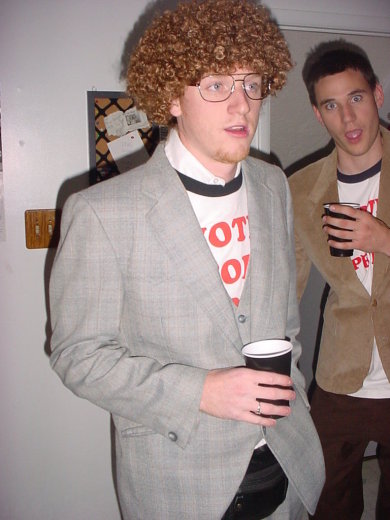 1995 Ford Probe - Two men dressed in costumes for Halloween '05, one wearing an afro wig and glasses.