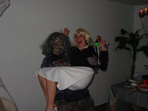 1995 Ford Probe - Two individuals in Halloween costumes pose for a photo, one with a zombie mask and the other with a blonde wig.