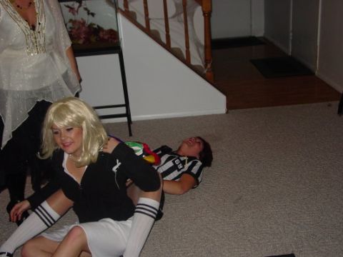 1995 Ford Probe - Two people in costumes are on the floor, one lying down and the other sitting.