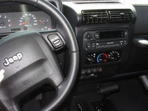 2000 Jeep TJ - Interior view of a 2000 Jeep TJ, highlighting the dashboard and steering wheel details.