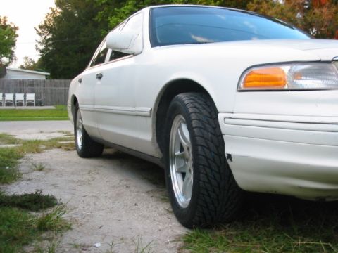 1997 Ford Crown Victoria - Front passenger side view of a white 1997 Ford Crown Victoria.
