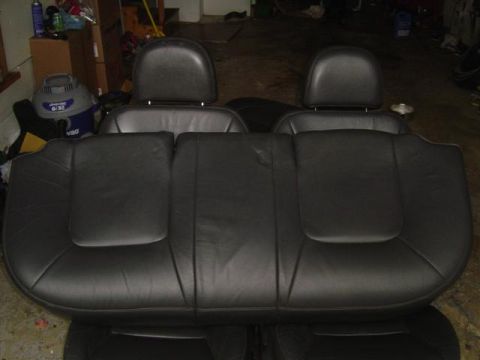 1994 Ford Taurus - Rear leather car seats with headrests are shown in this image.