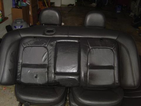 1994 Ford Taurus - Rear car seats are shown removed from a vehicle, likely for repair or replacement.