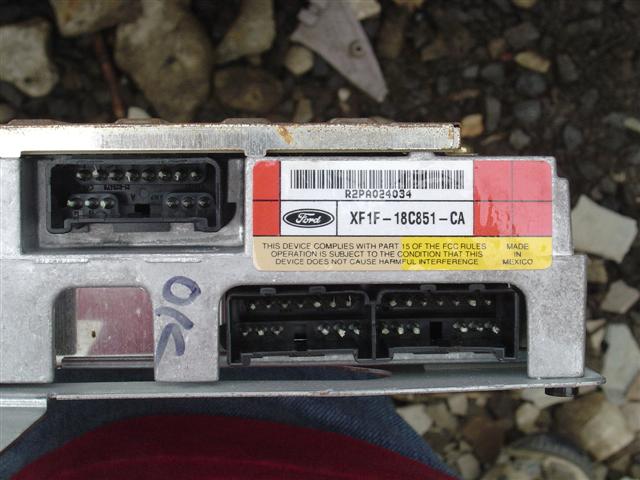 Ford electronic control module with part number XF1F-18C851-CA and R2PA024034