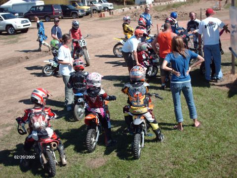 1995 Ford Probe - Young riders prepare for a race at a dirt track event.