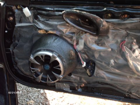 1995 Ford Probe - Aftermarket speaker and custom door handle are visible after removing the car's door panel.