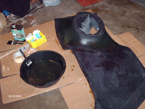 1995 Ford Probe - Custom speaker enclosure being worked on with resin and tools.