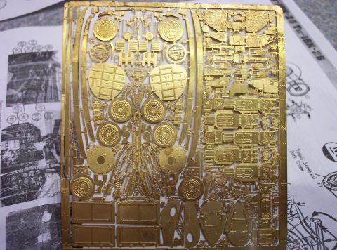 1998 Ford Crown Victoria - Model kit photo-etched parts on a brass sprue, likely for a detailed scale model.