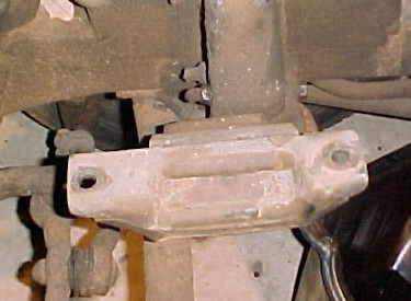 1965 Ford Mustang - This photo shows a close-up of a vehicle's suspension system, focusing on a specific mechanical part.