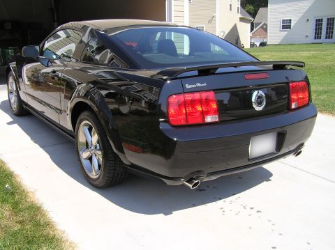 2007 Ford Mustang - Rear view of a black 2007 Ford Mustang coupe with a spoiler.