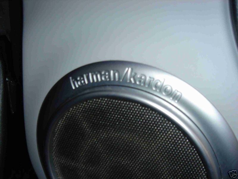 Harman/Kardon speaker with silver bezel and black mesh grille